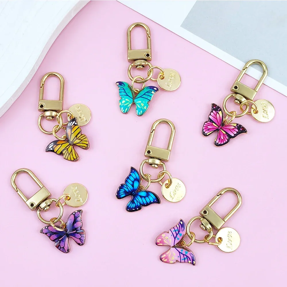 Exquisito llavero de mariposa esmaltado, llavero con etiqueta redonda de Metal, colgante para bolso de mujer y niña, accesorios DIY