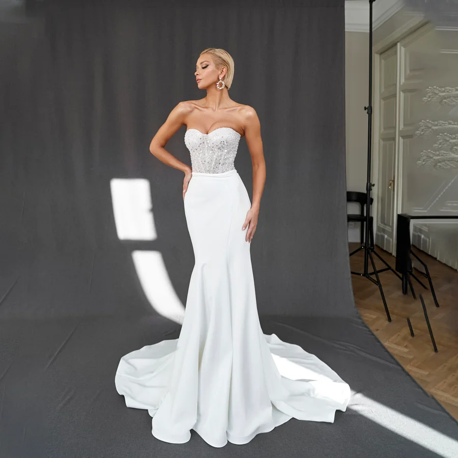 

Glistening Sequin Mermaid Wedding Dress with Sweetheart Neckline Luxurious Beaded Backless Bridal Gown with Watteau Train