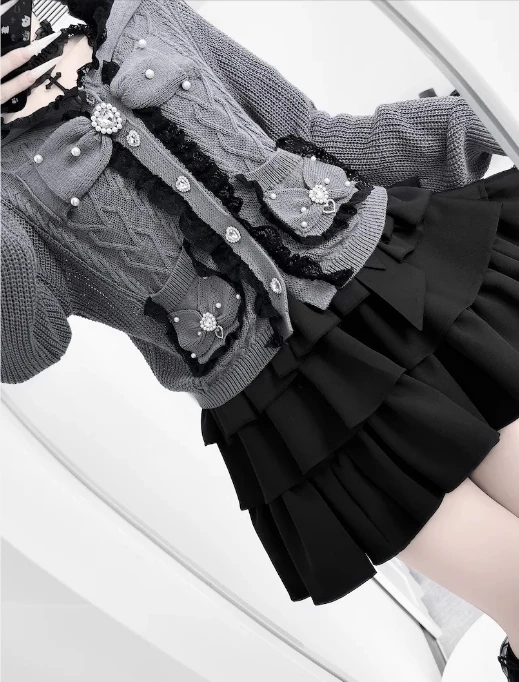 

Новый комплект 2026 года: вязаный пуловер с бантом в японском стиле и короткая юбка-пачка с завышенной талией для девочек