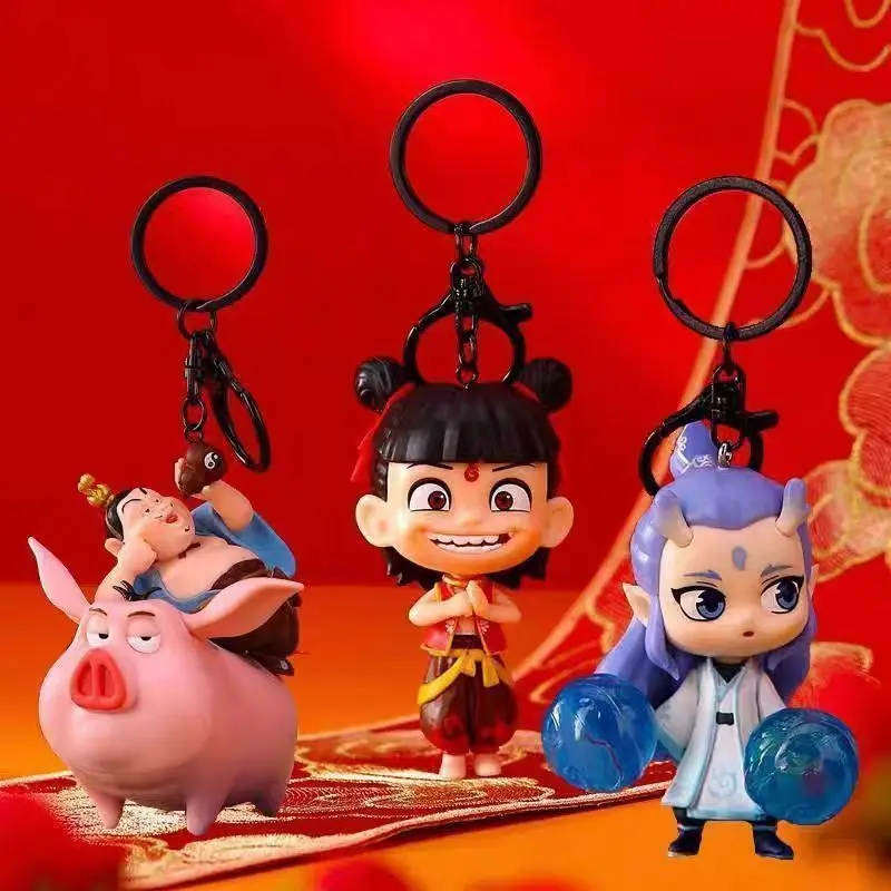 New Nezha keychain flying pig around the doll keychain pendant desktop small ornaments gift car keychain bag pendant couple gift