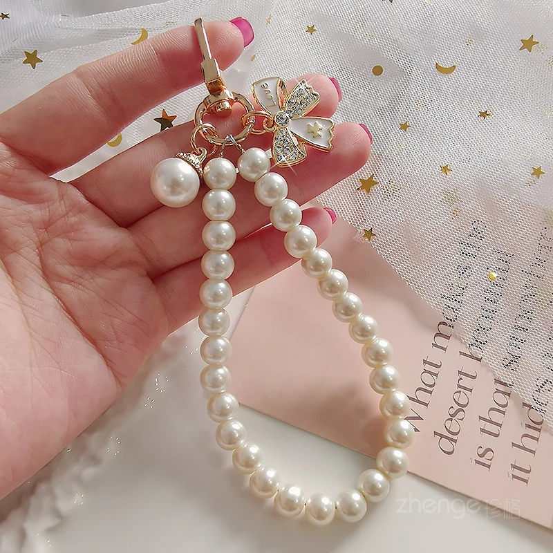 Mobile Phone Lanyard Wrist Rope Inlaid with Rhinestone Bow Pearl Bracelet Hand String Pearl Mobile Phone Lanyard Chain Hand