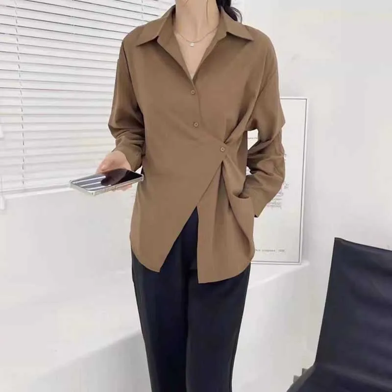 Fashion Lapel Button Solid Color Asymmetrical Shirts Women Clothing 2024 Spring Summer New Loose Casual Tops Irregular Blouses