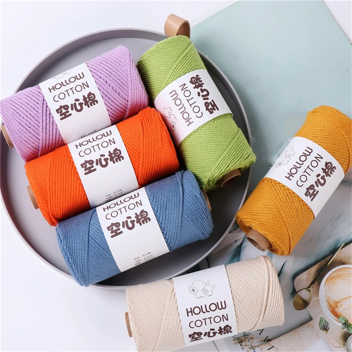 A Roll of 2mm Hollow Cotton Round Strand Yarn DIY Woven Round Rope is Used to Hook and Weave Hollow Cotton Thread for Bags