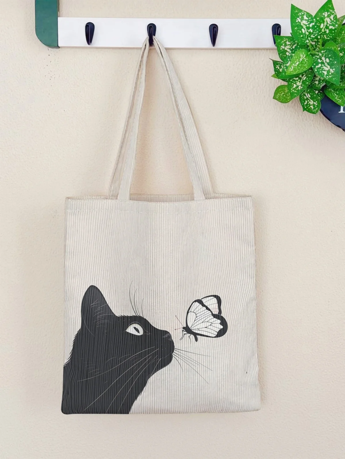 

Corduroy black cat and butterfly minimalist tote bag, suitable for daily commuting and shopping, easy to carry various necessiti