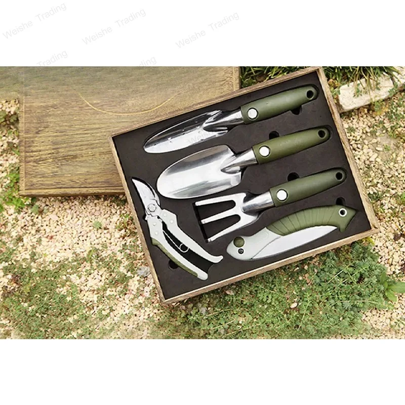 

Gardening, flower tool set, garden planting flowers, digging shovels, rakes, pruning shears, handsaws