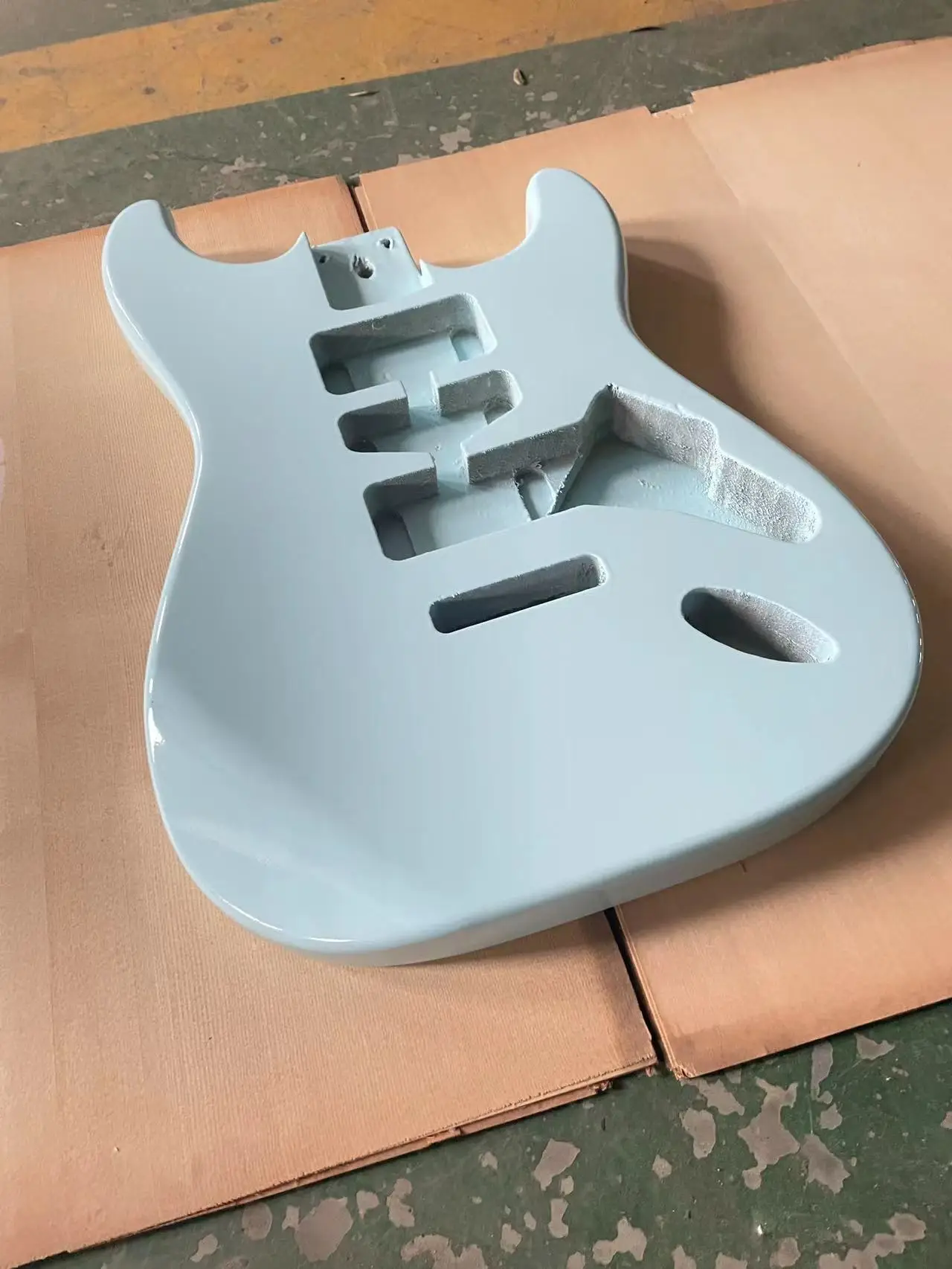 The blue glossy guitar panel is an ST style electric guitar with a half empty heart barrel DIY guitar. The colored guitar body i