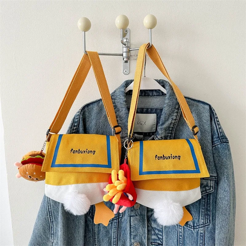 กระเป๋าสะพายข้างผู้หญิง ลายการ์ตูนเป็ดน่ารัก กระเป๋าสะพายไหล่ผู้หญิง กระเป๋าผ้าแคนวาสส่วนตัว กระเป๋าใส่โทรศัพท์มือถือผู้หญิงสุดอินเทรนด์