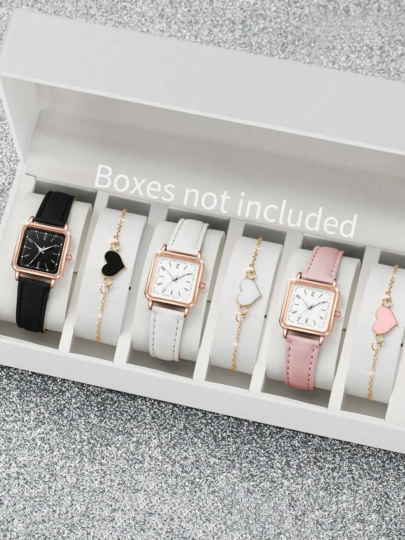 

Набор из 6 предметов: кварцевые часы с квадратным циферблатом и браслет с подвеской в виде сердца в черном, белом и розовом цветах.