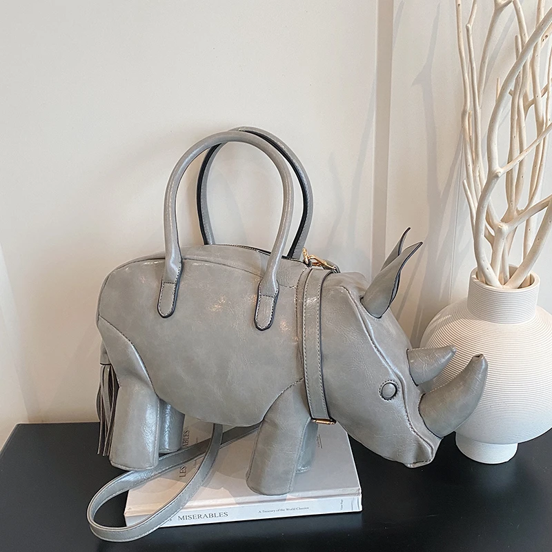 

2026 New PU Material Rhinoceros Handbag Women's Creative Animal Shape Dual-use Shoulder Bag Minority Tassel Design Hot Sale