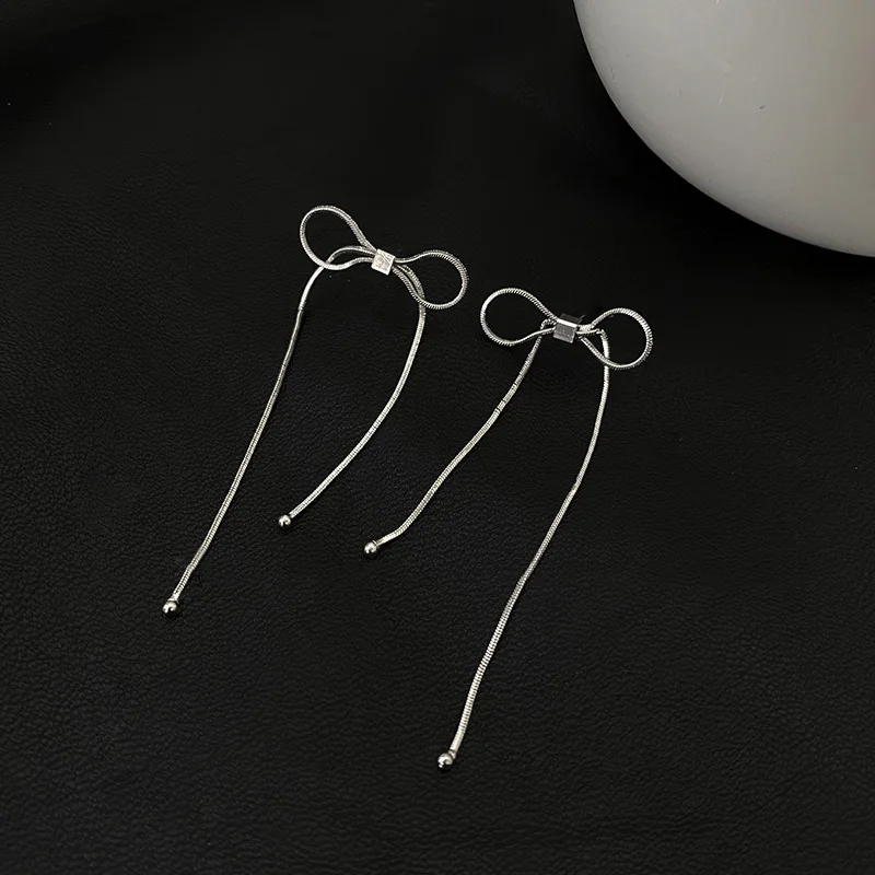 

Sam panda 925 Sterling Silver Bow Earrings Temperament Feminine Personality Exaggerated Tassel Long Earrings New Trend