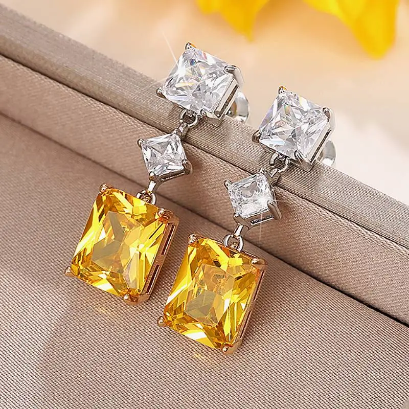 Huitan Trendige Tropfenohrringe für Frauen, Verlobung, Hochzeit, Damenaccessoires mit glänzendem gelbem CZ, eleganter Schmuck für Party und Alltag
