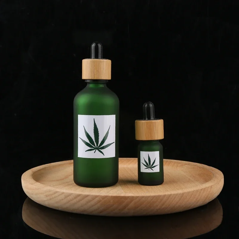

whosesale Skincare bamboo dropper Green frosted Glass CBD Oil Dropper Bottle with Bamboo pipette Cap Cosmetic Serum Bottle