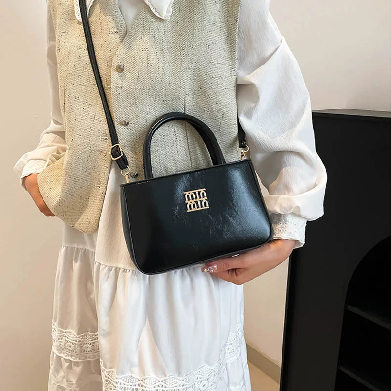 2025 new style retro foreign girl's hand bag minority parent-child crossbody bag mouth red envelope large capacity