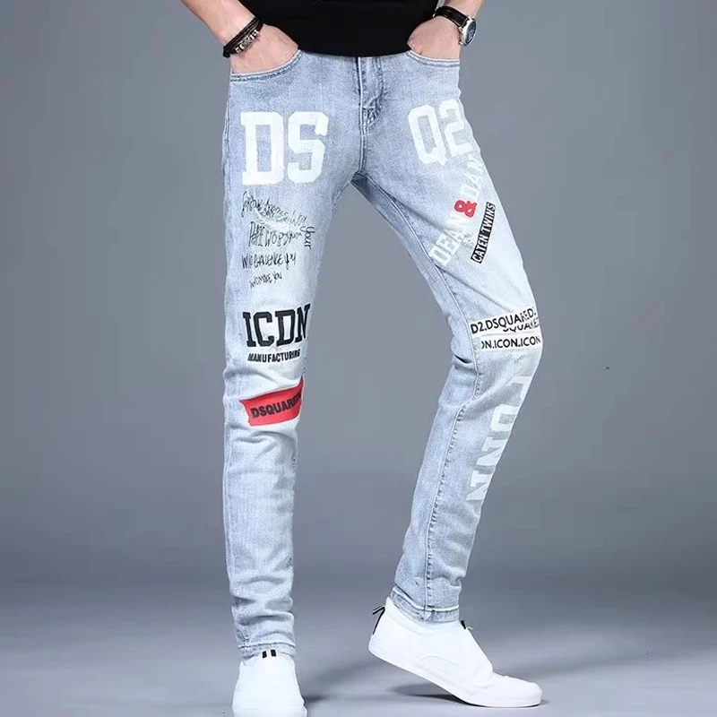 Moda Koreańskie Dżinsy Męskie Graffiti Nadrukowane Litery Spodnie Dżinsowe Męskie Streetwear Slim Fit Niebieskie Dżinsy Hip hop Małe Spodnie Stóp