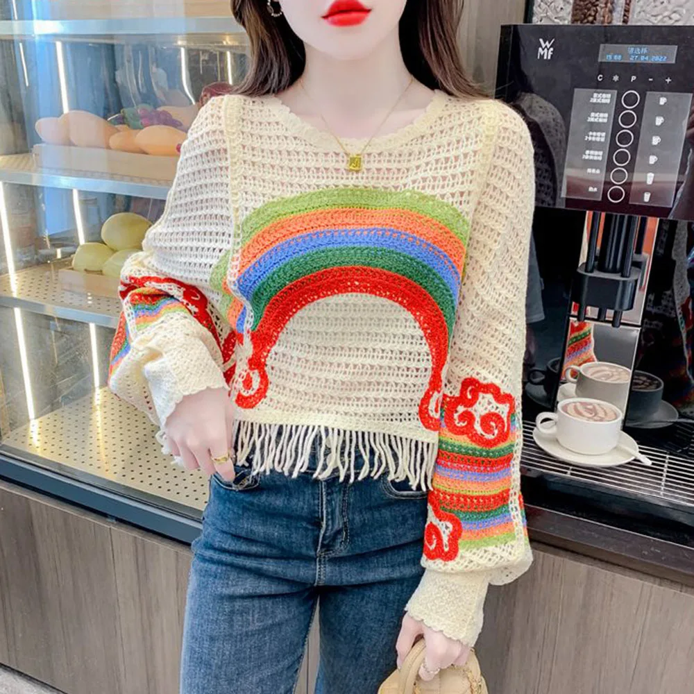 Spring And Summer 2024 New Openwork Rainbow Striped Loose Sweater Female French Chic Tassel Design Elegant Leisure Sweater Tide.