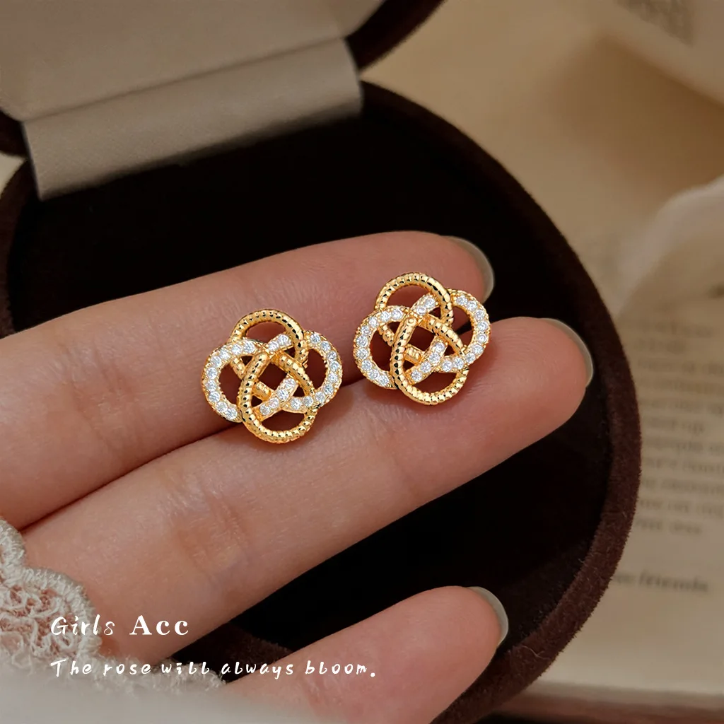 

Women Fashion Light Luxury Micro Inlaid Zircon Hollow Knot Stud Earrings Niche Personality Design High end Geometric Ear Jewelry