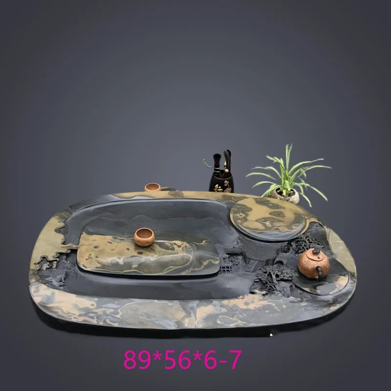 Tea tray black round natural rough stone material creative hand-carved tea table single-layer drainage Chinese tea sea