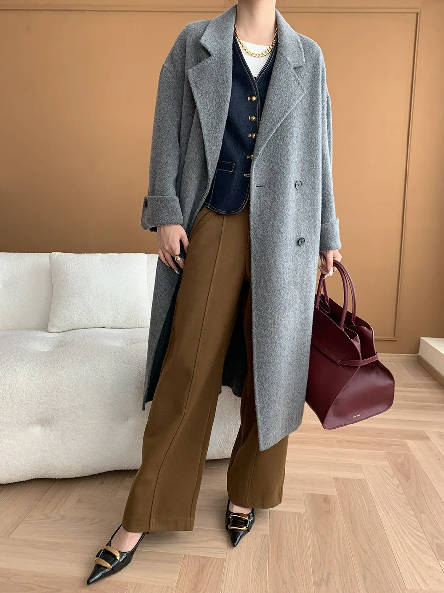 Autumn and winter women's casual solid color double breasted waistband decoration loose long coat