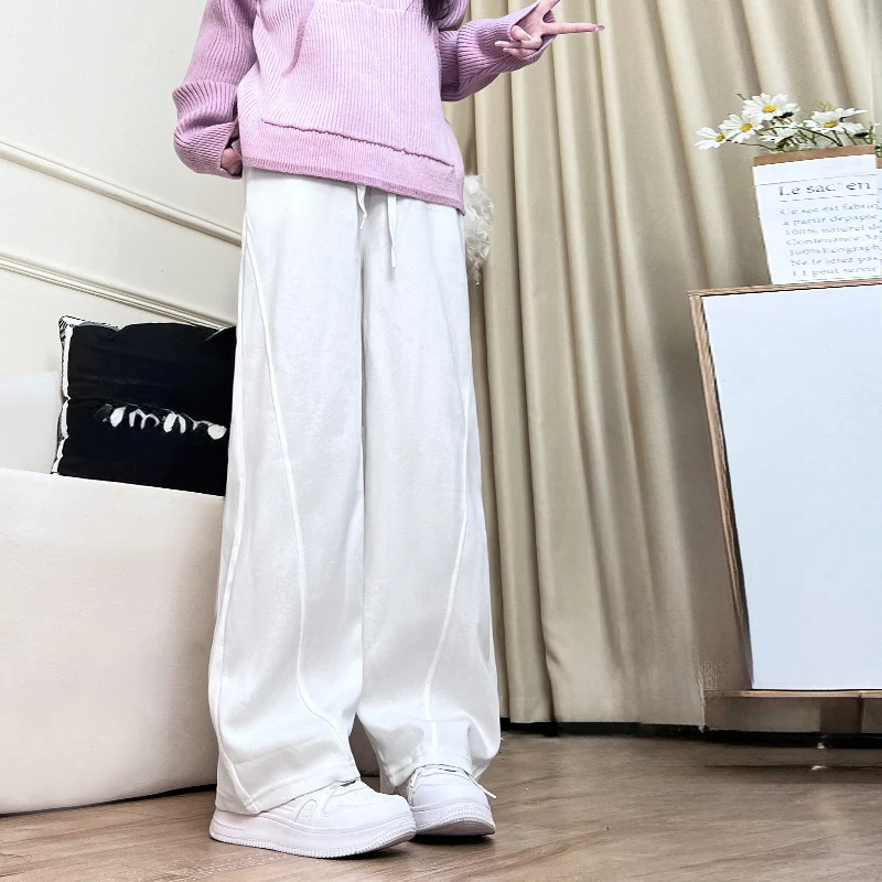 Damskie spodnie dresowe hip-hop na jesień i zimę 2025, modne, elastyczny pas, luźne, szerokie nogawki, proste, jednolite, ze sznurkiem.