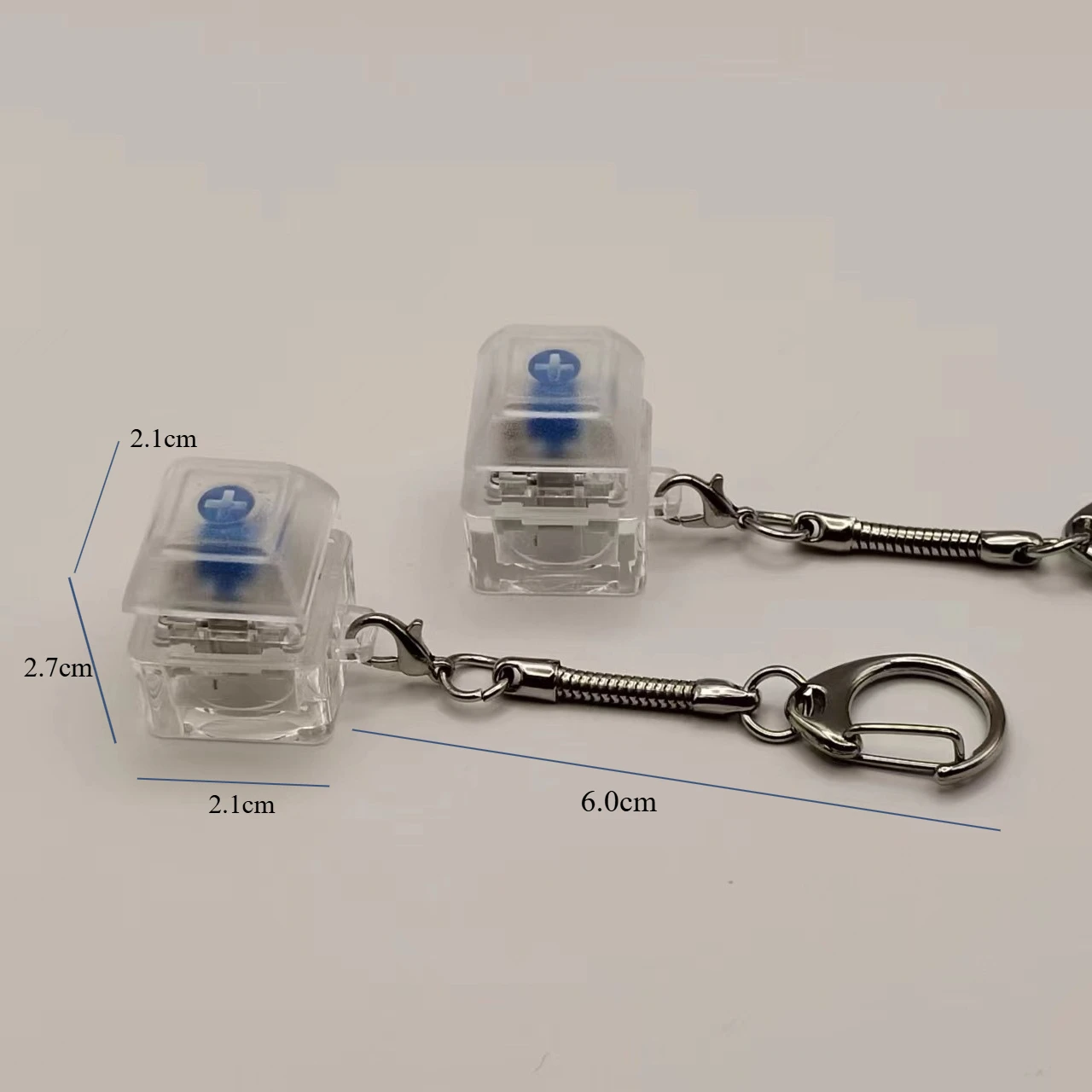 新しい創造的な人格ストレスリリーフおもちゃかわいい猫の足キーボードキーチェーンペンダントカップルバッグペンダントおもちゃギフト