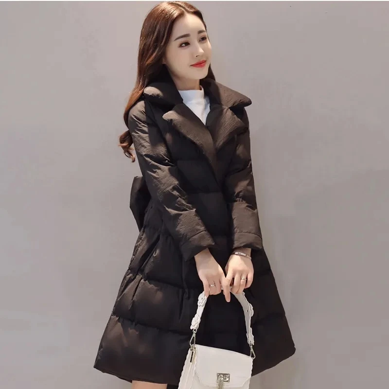 Korean version princess fluffy skirt cotton coat women's winter clothing thick medium long A-line cape waist cinching tied thick