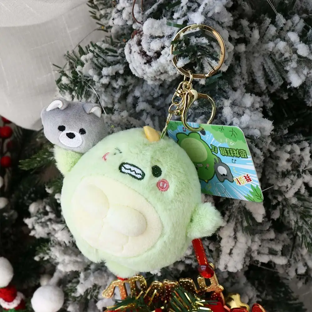 Porte-clés dinosaure vert portant un loup en peluche, pendentif beurre, mignon et drôle, Kawaii