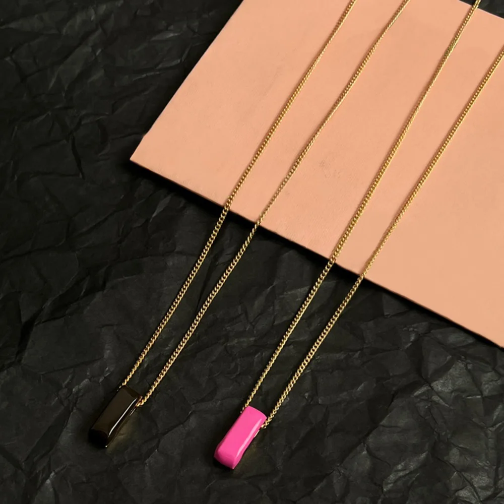 

Trendy Minimalist Gold Chain Necklace with Rectangular Bar Pendant Fashion Accessory for Women in Pink Black Gold Colors