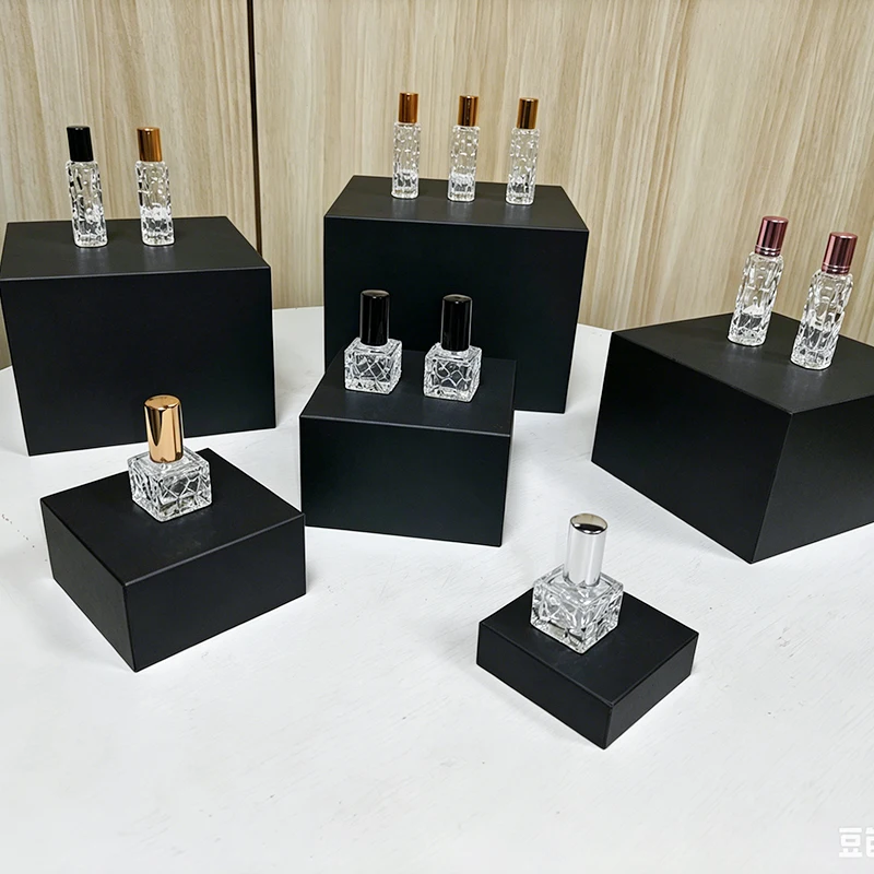 Black hollow acrylic cube display stand, dessert cake macaron tiered display stand, perfume jewelry figurine product photography display box, commercial window layered display stand