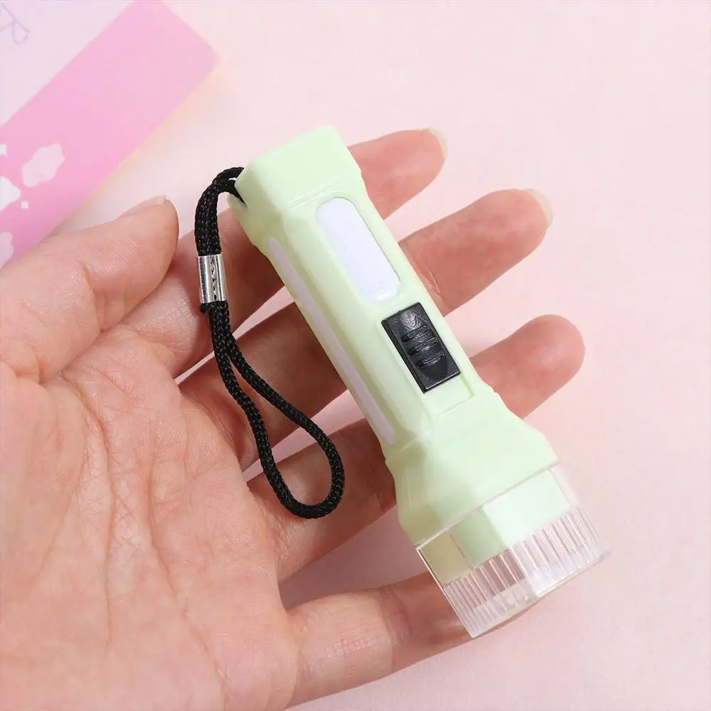 Lampada torcia a LED ultra luminosa con corda sospesa Luce forte Portachiavi Luce Mini piccola penna Luce Giocattoli educativi