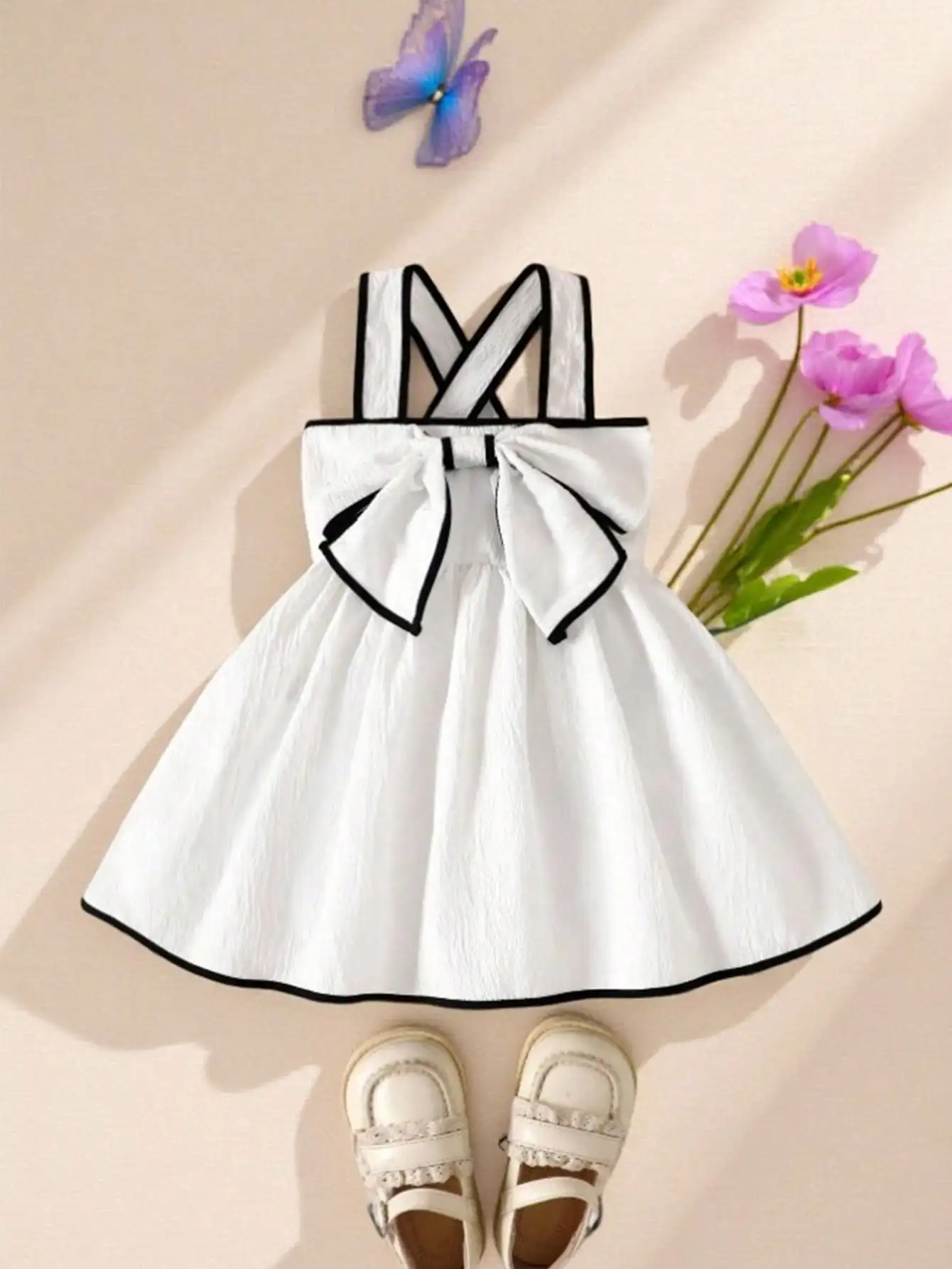 

White Textured Bow Detail Sleeveless Dress for Girls with Black Trim
