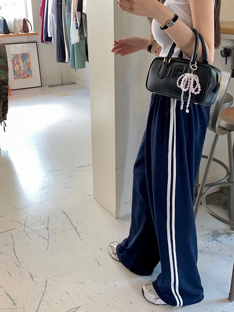 กางเกงขายาวลายทางลำลองสำหรับผู้หญิง เอวยางยืดแบบผูกเชือก ทรงหลวม ใส่สบาย ช่วยพรางหุ่น แฟชั่นทันสมัย