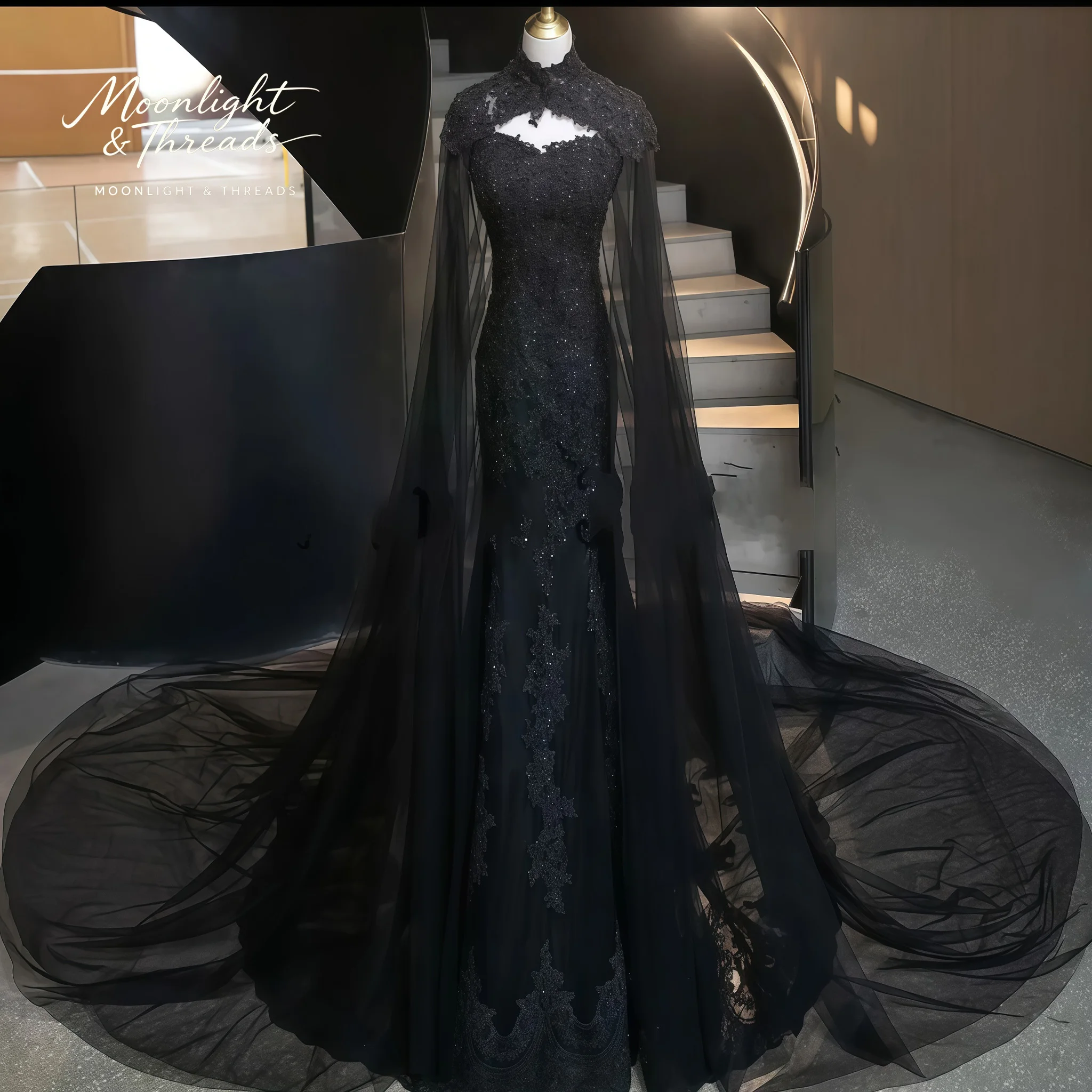 

Black lace strapless sleeveless floor-length formal wedding gown with embroidery and a high-neck floor-length cape
