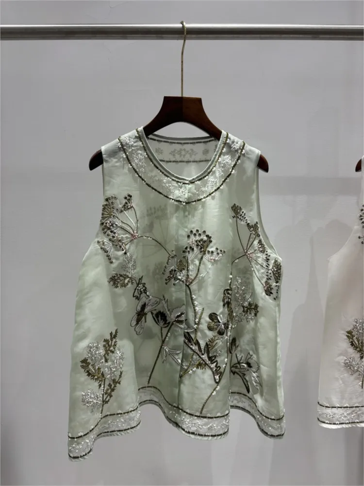 A woman in light and traditional Chinese style featuring heavy silk organza precise gold thread embroidery