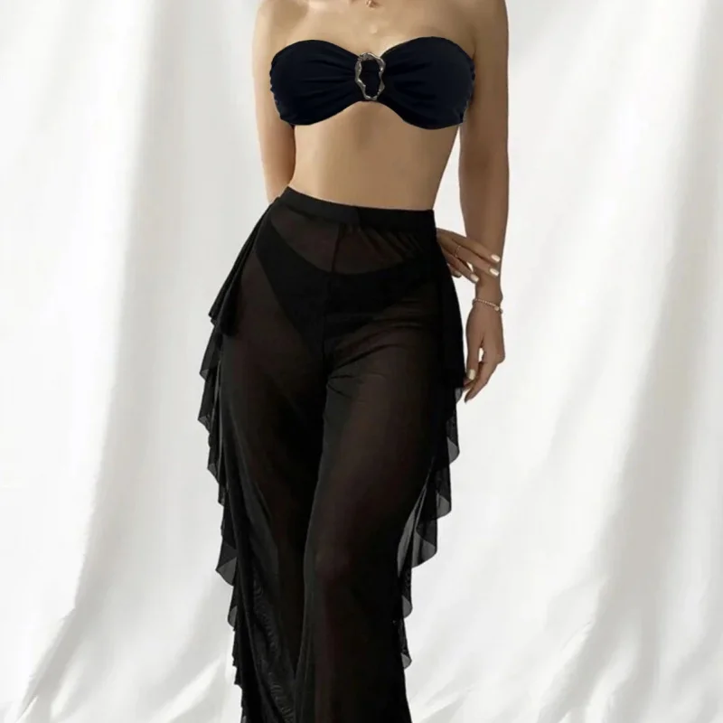 

Комплект из трех предметов: купальник-бикини без бретелек с металлическими элементами, сетчатые прозрачные пляжные длинные брюки