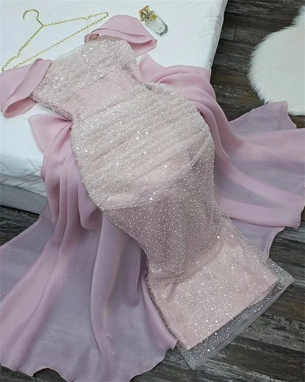 Yipeisha elegant off shoulder pink ball gown with a bow the back and sequins on the body, uniquely designed with dazzling colors