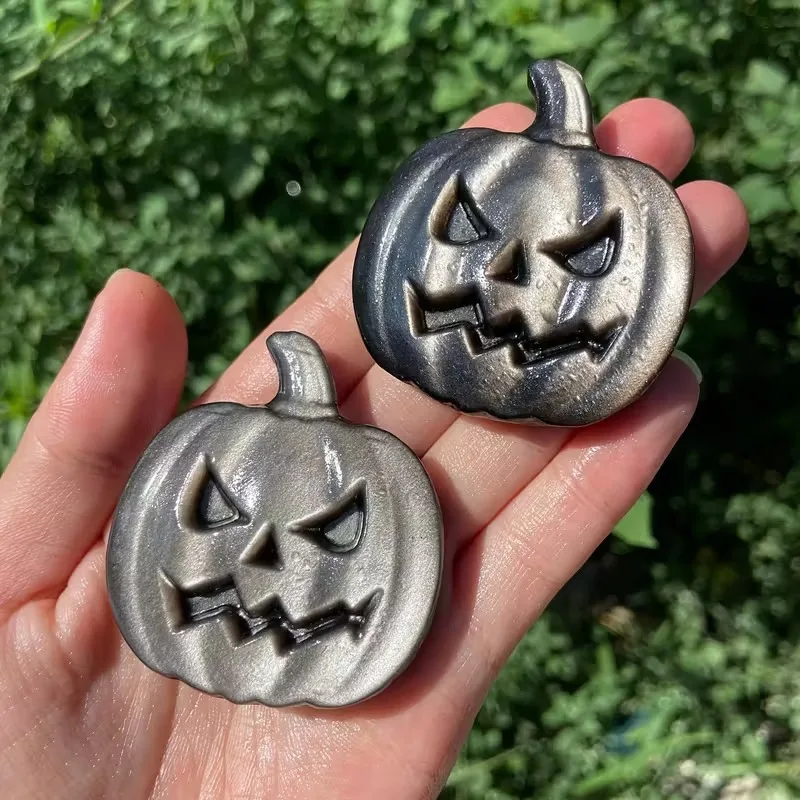

An obsidian pumpkin face, available in silver or gold, hand-carved from natural stone. Perfect for home decor or holiday gifts.