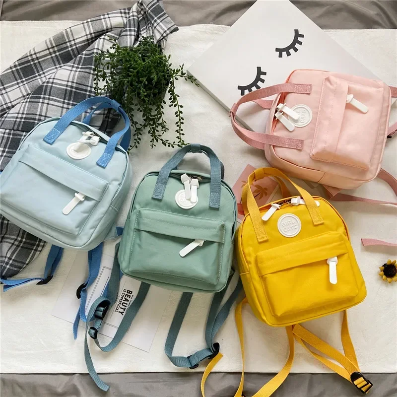 Mochilas para niños, nuevo bolso escolar para niñas, Mini mochila Retro para mujeres, mochilas pequeñas de Color sólido a la moda para estudiantes