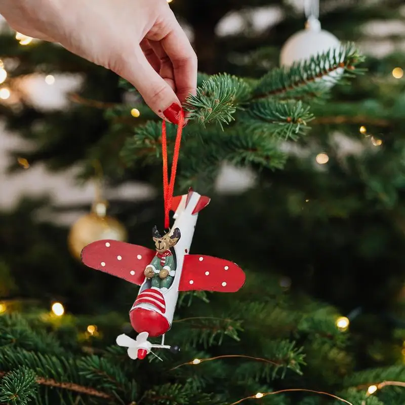 Estatuetas de natal dos desenhos animados rena no avião estatueta árvore pingente metal avião modelos peças centrais natal pendurado ornamento