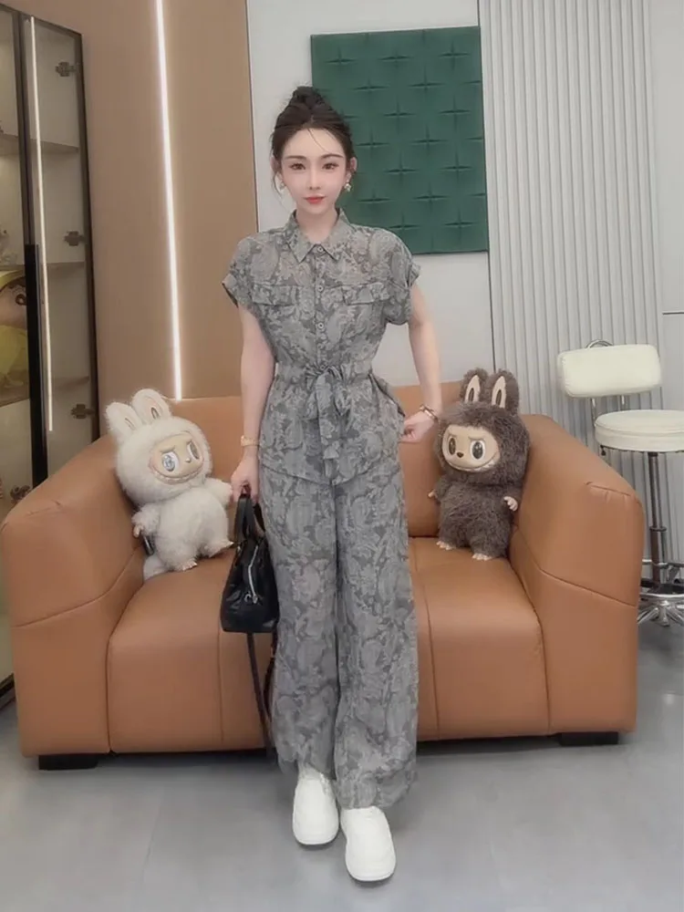 

Women in summer 2025 featuring trendy colors short sleeved waist cinched shirt wide leg pants stylish two-piece set