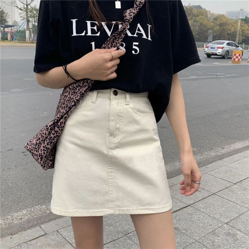 Solid color denim skirt female students Korean version of high-waisted versatile niche package hip a-line half-body short skirt