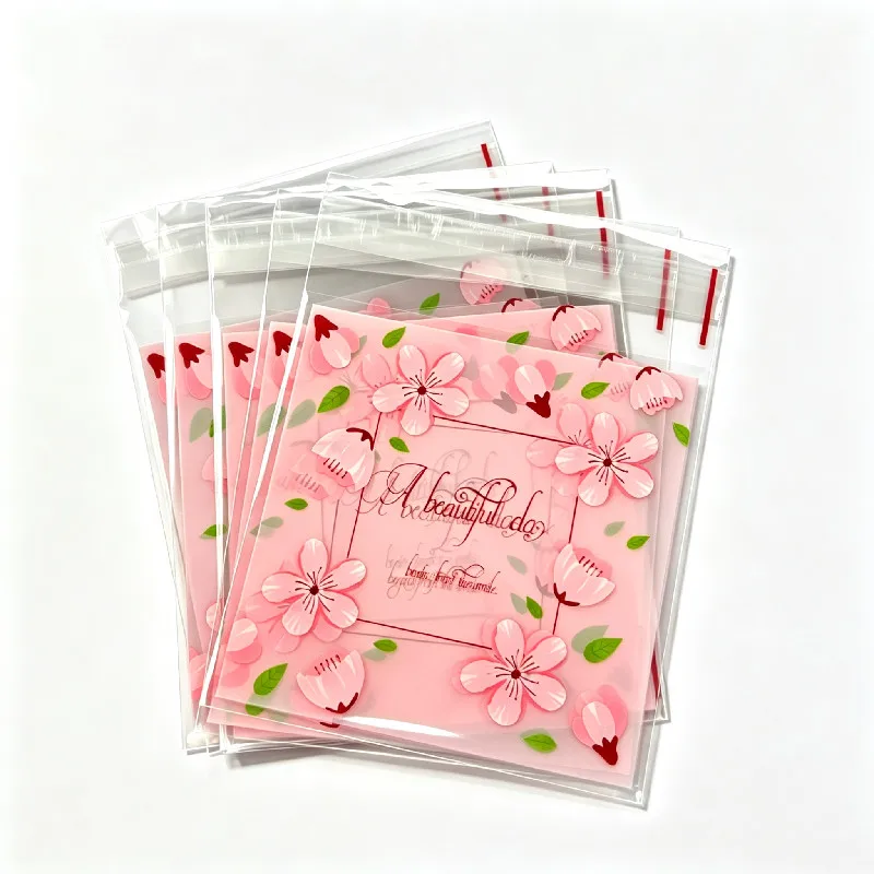 100 unidades/lote, bolsas de plástico con cierre adhesivo para regalos, con diseño de flores de cerezo rosas, ideales para envolver caramelos, galletas y pasteles.