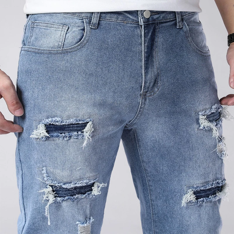 Jeans strappati skinny azzurri autunnali da uomo Pantaloni lavati vintage a media elasticità Pantaloni alla moda casual alla moda quotidiana