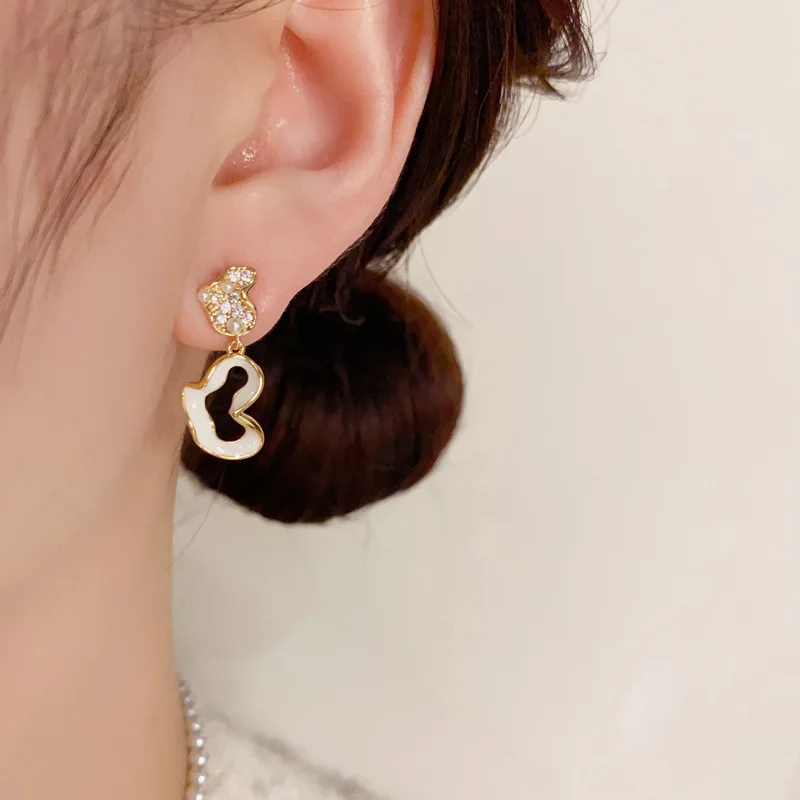 Korean Version Commuting Fashion Design with Asymmetrical Drop Oil Zircon Heart Exquisite Versatile Unique Earrings.