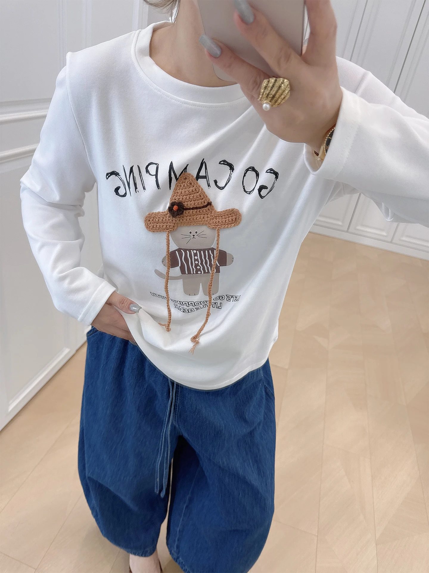 

Повседневная свободная футболка с мультяшным принтом, больших размеров, женская одежда, скрывающая недостатки фигуры, стройнящий топ в корейском стиле, с длинным рукавом, из смесового хлопка