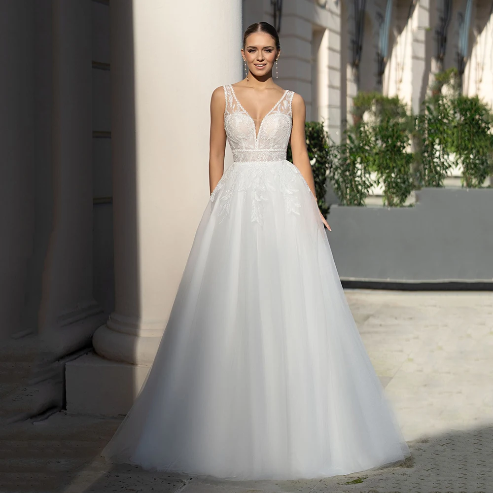 فساتين زفاف على شكل حرف A بدون أكمام بدون ظهر فستان زفاف على شكل حرف V دانتيل زينة تول طول الأرض فساتين العرائس حسب الطلب