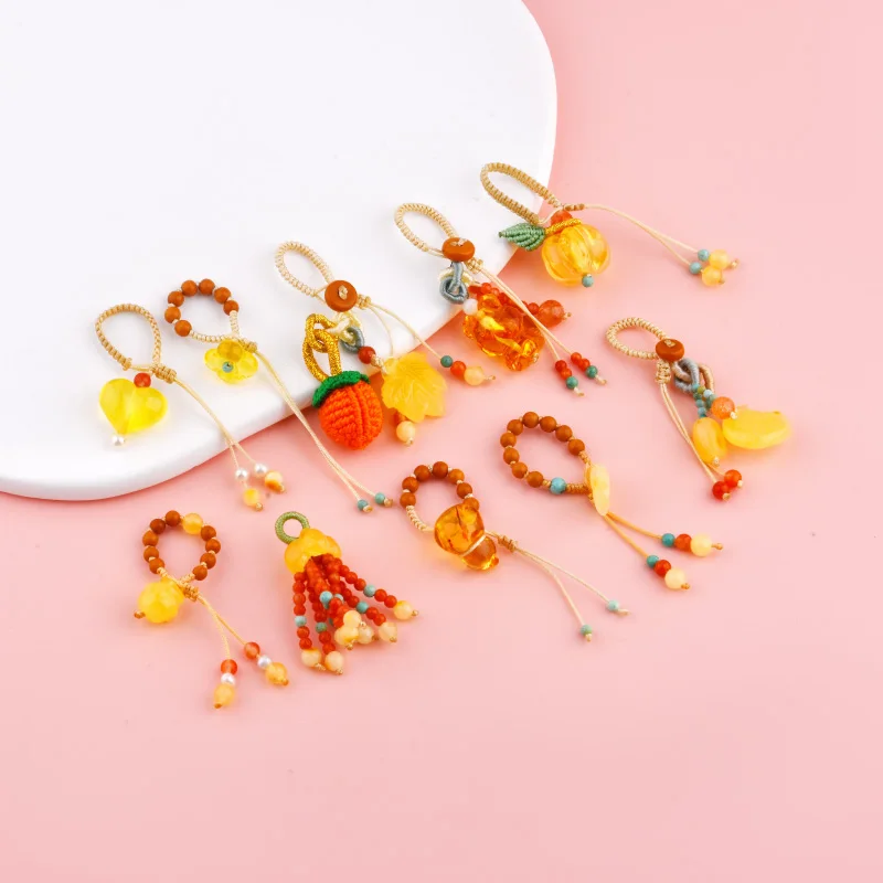 Natural beeswax is processed into beads, forming a moon-shaped heart-shaped maple leaf fish tail pendant necklace.