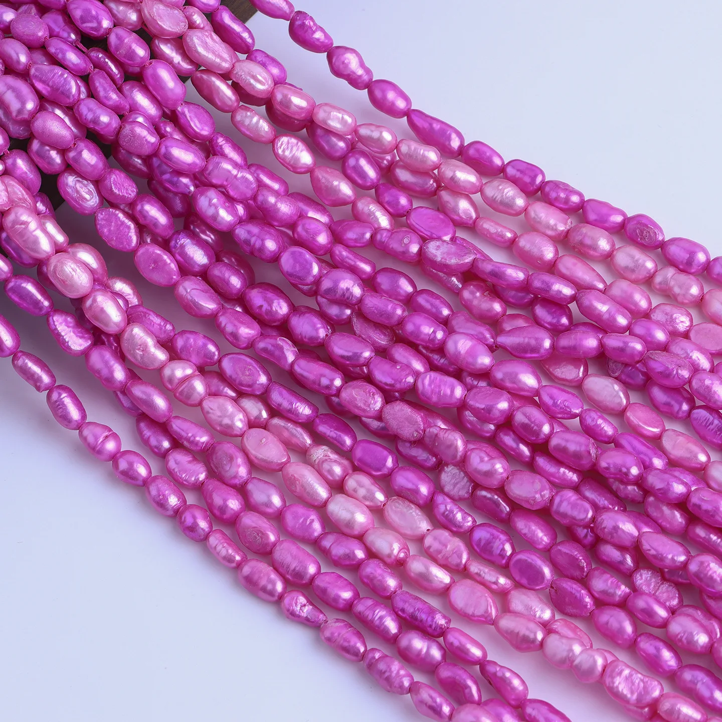 

Hot-selling 4-5mm Rose Red Pink Straight Hole Two-sided Light Natural Freshwater Baroque Pearl DIY Material