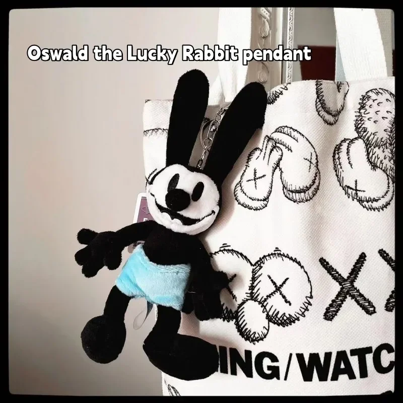 Oswald จี้ตุ๊กตากระต่ายนำโชคพวงกุญแจน่ารักกระเป๋าเป้สะพายหลังตกแต่งการ์ตูนอุปกรณ์ต่อพ่วงตุ๊กตาเพื่อนของขวัญวันคริสต์มาส