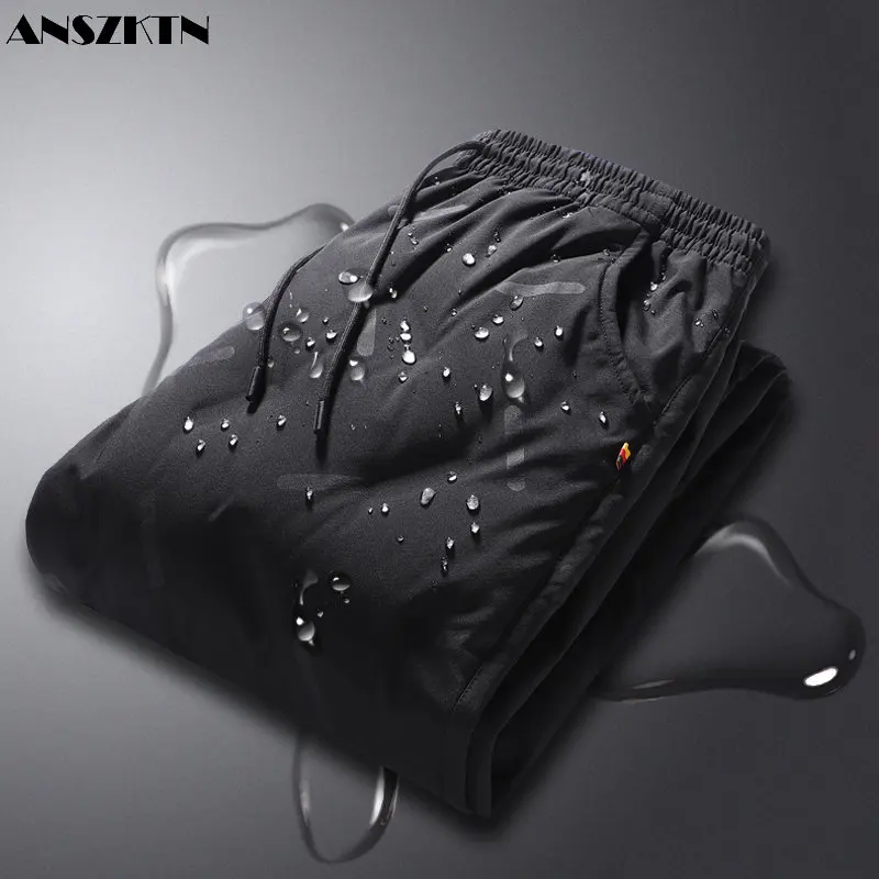 

ANSZKTN 2022 new edition slim flat foot down pants warm and thick winter men's fashion light down pants men