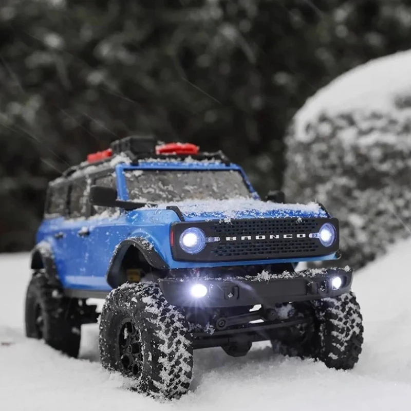 محوري 1/24 فورد برونكو Scx24 مركبة تسلق كهربائية يتم التحكم فيها عن بعد على الطرق الوعرة محاكاة السيارة